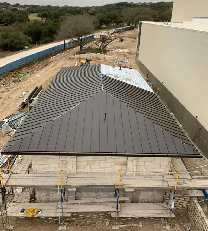 Metal roof new construction with scaffolding in Eagle Pass